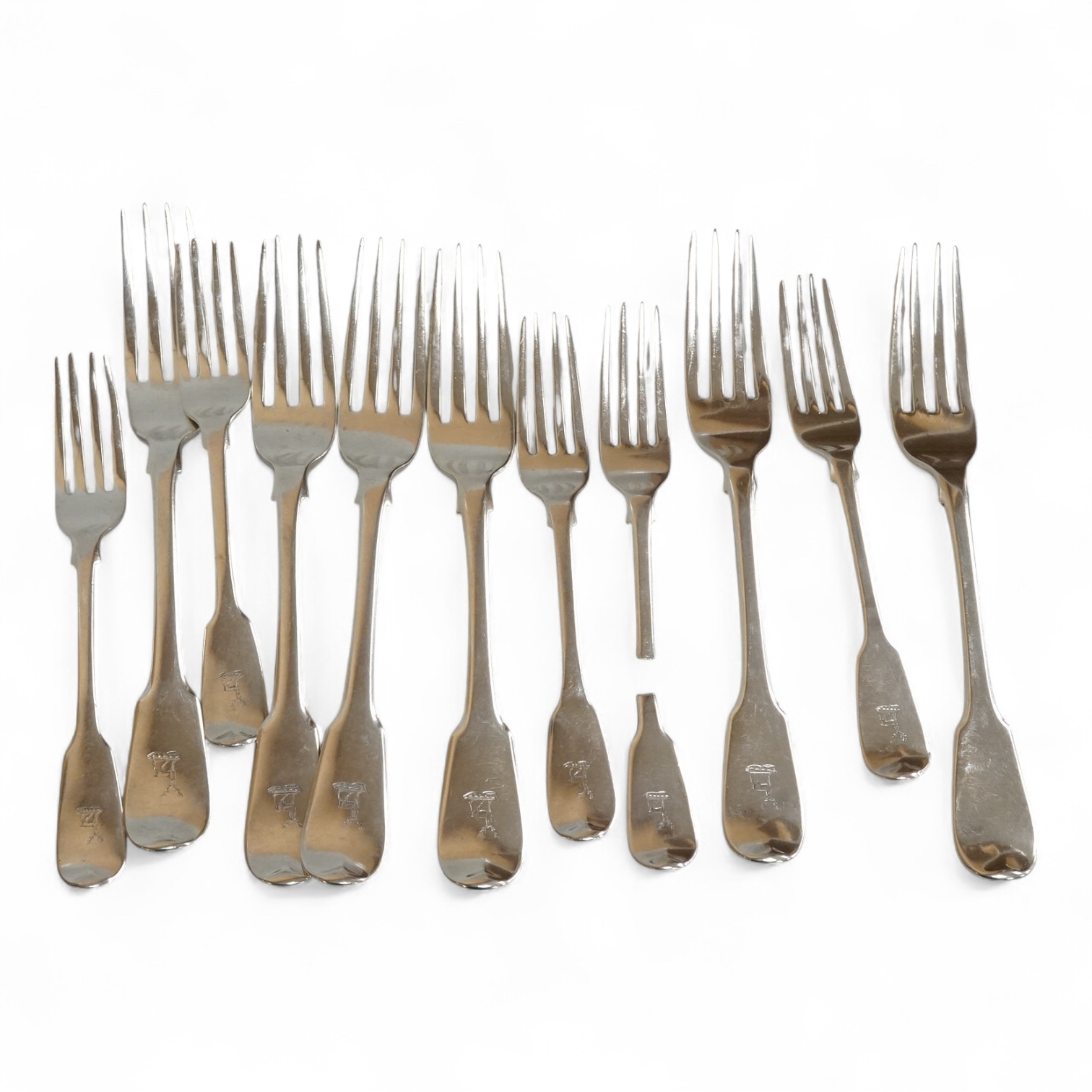 A set of six late George III silver fiddle pattern table forks, Thomas Wilkes Barker, London, 1818, together with five 19th century assorted silver fiddle pattern dessert forks, one broken in half, 18.8oz.